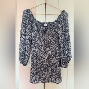 Blue dress with puffed sleeves white float print